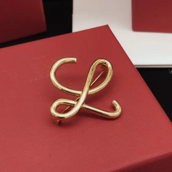 Loewe Anagram brooch gold tone metal no stones 4 5cm width