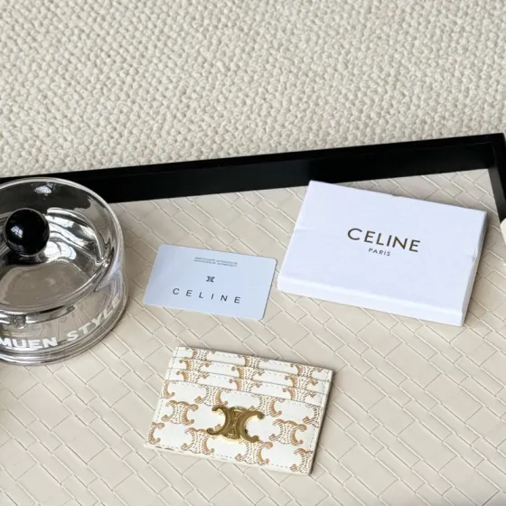 Celine Triomphe card holder white coated canvas with gold-tone Triomphe monogram print and gold-tone metal hardware 10cm x 7cm