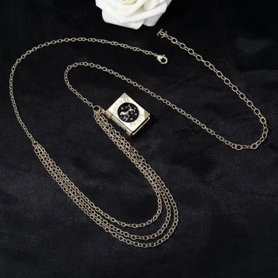 Chanel Goose series Lion Book Locket Waist Chain necklace Gold-tone metal with black enamel and silver-tone lion CC logo detailing 80cm