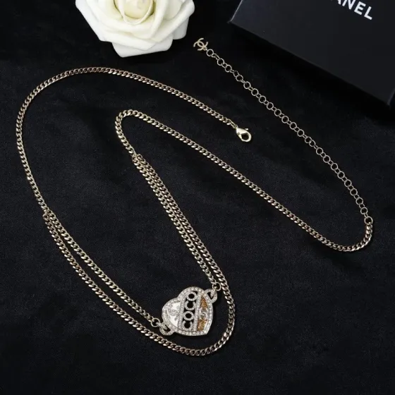 Chanel Coco Heart Waist Chain necklace Light gold tone metal with clear crystal and champagne glitter accents white enamel detail 80cm with 15cm extension