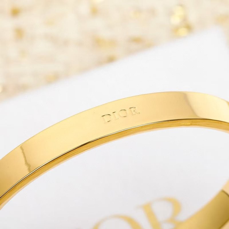 Dior CD New Christian Dior Night Code Bangle bracelet Gold-tone metal with clear crystal accents available in white enamel and black enamel variants M