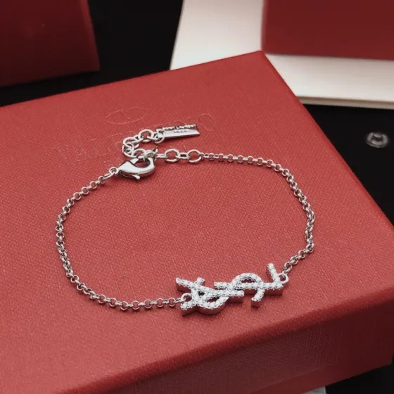 Saint Laurent YSL Monogram Crystal Charm Bracelet bracelet silver-toned metal with clear crystal accents 18cm with 3cm extender