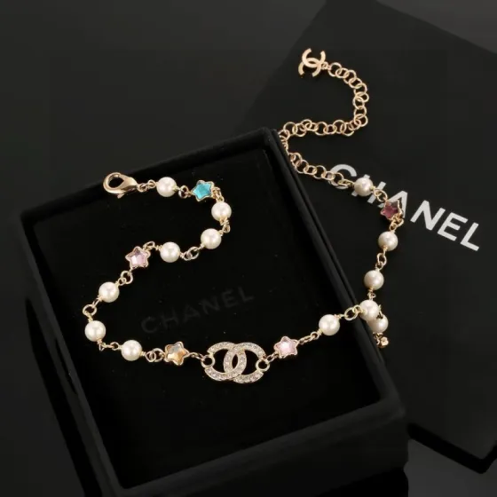 Chanel CC Logo Multicolor Star Pearl Bracelet bracelet Gold-tone metal white faux pearls clear crystals multicolor star stones blue pink purple yellow champagne 18cm with 5cm extension chain