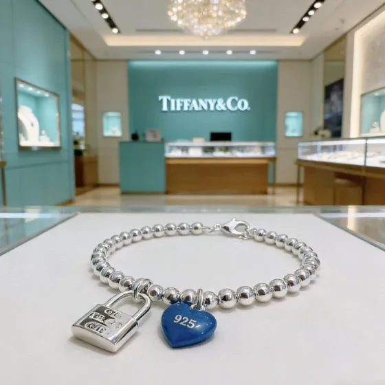 Tiffany Co Return to Tiffany Bead Bracelet with Blue Heart Tag and Lock Charm bracelet Sterling silver with blue enamel heart charm 18cm