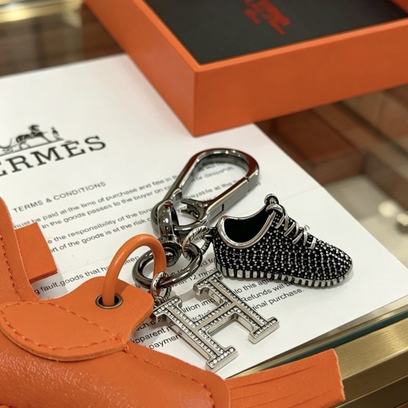 Hermes Rodeo H Logo Sneaker Charm Keychain pendant Orange leather gunmetal hardware clear crystal accents black and silver sneaker charm 12cm total length