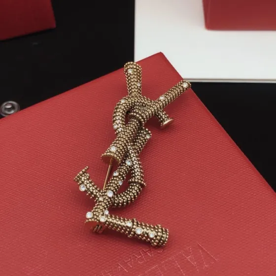 Saint Laurent Cassandre YSL Monogram Beaded Crystal Brooch brooch antique gold tone metal with clear crystal accents 4 5cm length