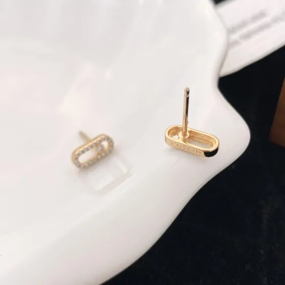 Messika Move Uno earrings Yellow gold with clear pave diamonds and central moving diamond 10mm stud length