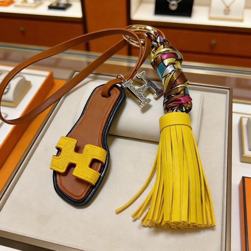 Hermes Oran Sandal Tassel Bag Charm pendant Gold-tone metal brown leather yellow leather multicolor silk silver-tone H charm 18cm strap length