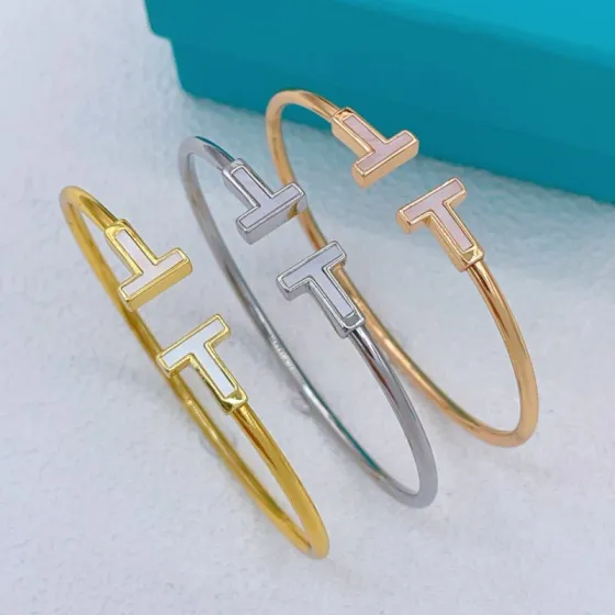 Tiffany Co T Wire bracelet Silver-toned metal with white mother-of-pearl inlay gold-toned metal with white mother-of-pearl inlay gold-toned metal with pink mother-of-pearl inlay 17cm inner circumference