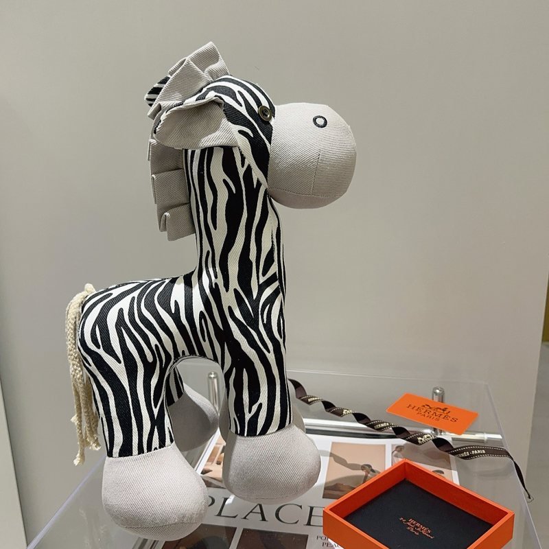 Hermes Zebra Plush brooch Light gray fabric with black and white zebra print off-white cord tail brass-toned metal buttons 35cm