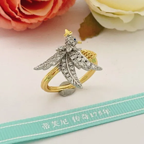 Tiffany Co 175th Anniversary Bird on a Wheat ring Two-tone yellow gold and platinum-plated metal clear pave diamonds blue sapphire eye US 7