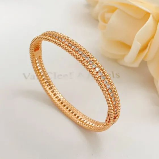 Van Cleef Arpels Perlee bracelet Rose gold metal with clear diamond accents 17cm inner circumference