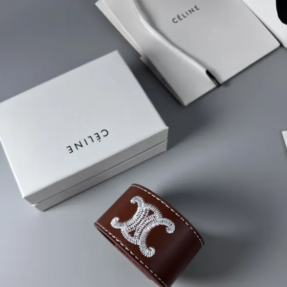 Celine Triomphe Embroidered Wide Leather Cuff bracelet burgundy brown smooth calfskin leather white contrast stitching silver-tone embroidered Triomphe logo silver-tone metal snap hardware adjustable snap closure 4cm width