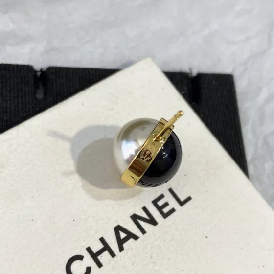 Chanel CC Logo Two-Tone Pearl Stud Earrings earrings Gold-tone metal white faux pearl black resin One Size 1cm diameter studs