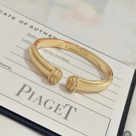 Piaget Possession bracelet 18k yellow gold with clear diamond accents 16cm inner circumference