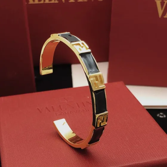 Fendi FF Logo Enamel Cuff bracelet Gold-tone metal with black enamel One Size standard open cuff 6 5cm inner diameter
