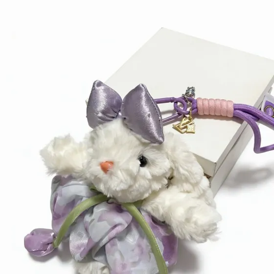 Louis Vuitton Anger Forest Plush Bunny Keychain Charm pendant Gold-tone metal hardware white plush lavender satin and fabric accents pink cord wrap purple cord strap orange bunny nose black bunny eyes green ribbon accents 12cm total strap length