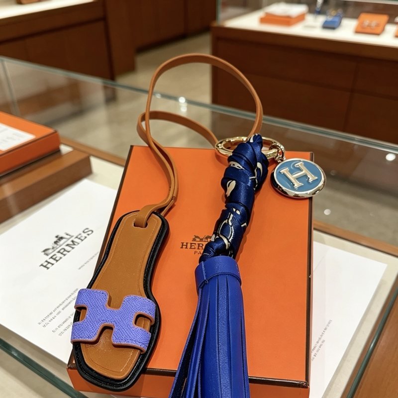 Hermes Oran Sandal Tassel Bag Charm Keychain pendant Brown leather purple H sandal detail royal blue leather tassel navy blue silk twilly wrap silver-tone metal with blue enamel H charm 12cm total length
