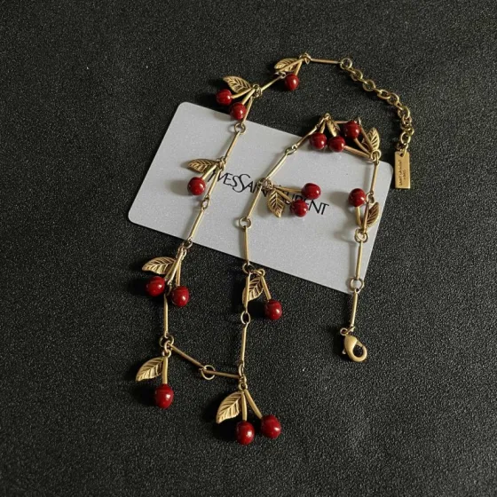 Saint Laurent 1961 Cherry Charm necklace antique gold metal deep red enamel cherry charms 42cm
