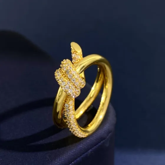Tiffany Knot ring Yellow gold with clear diamond pave accents US 7
