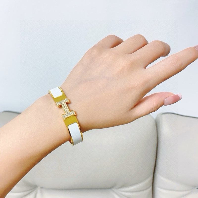 Hermes Clic H MM Diamond bracelet Yellow gold with white orange black enamel and diamond accents
