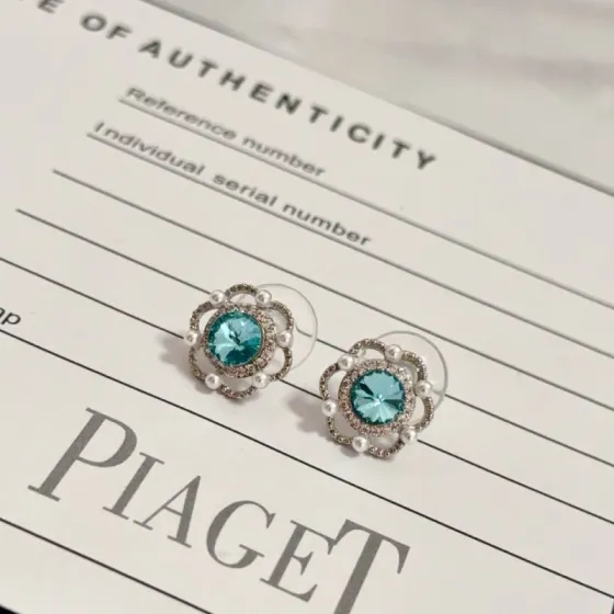 Piaget Rose earrings silver-toned metal paraiba tourmaline blue center stone white diamond accents white pearl accents 10mm stud diameter