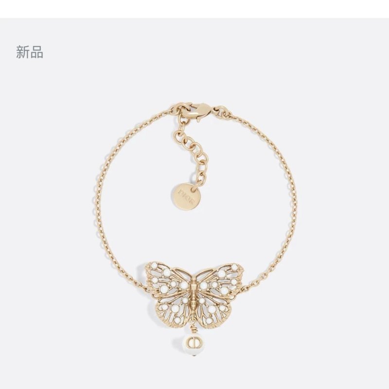 Dior Toile de Jouy Papillon bracelet matte gold metal with white resin pearl accents 16cm with 3cm extender chain