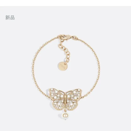 Dior Toile de Jouy Papillon bracelet matte gold metal with white resin pearl accents 16cm with 3cm extender chain