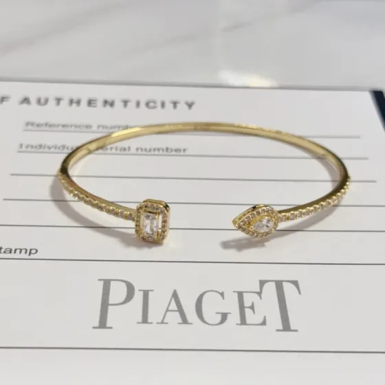Piaget Possession Open Bangle bracelet 18k yellow gold with clear diamond accents 17cm inner circumference