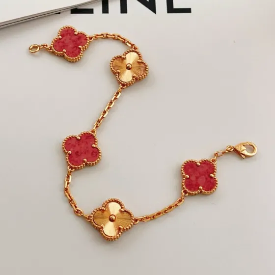 Van Cleef Arpels Vintage Alhambra bracelet 18k rose gold with red stone and guilloche rose gold clover motifs 18cm