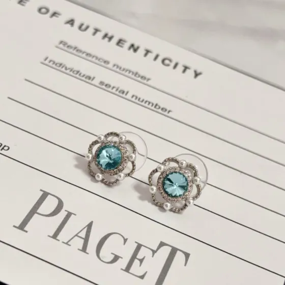 Piaget Rose earrings silver-toned white gold aqua blue central gemstone white diamond accents white pearl accents 10mm stud diameter