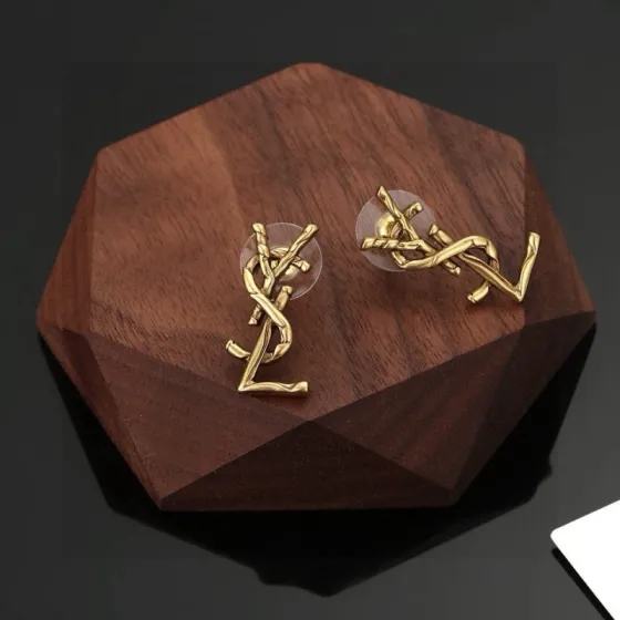 Saint Laurent Cassandre Twisted Monogram earrings antique gold tone metal no gemstones 2 2cm length