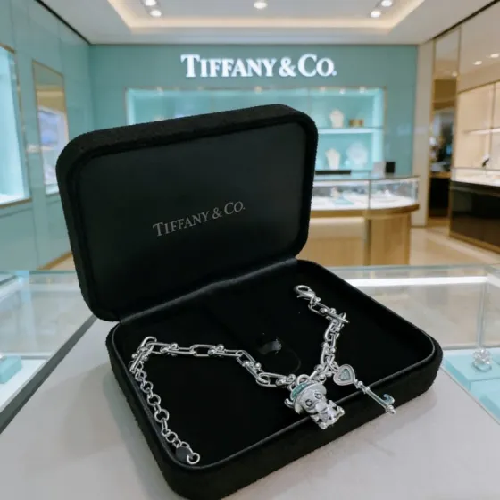 Tiffany Co HardWear Charm bracelet silver metal with light blue and pink enamel accents 18cm