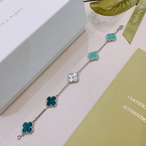 Van Cleef Arpels Alhambra bracelet Silver-toned metal with turquoise blue deep teal blue and white mother-of-pearl four-leaf clover motifs 18cm