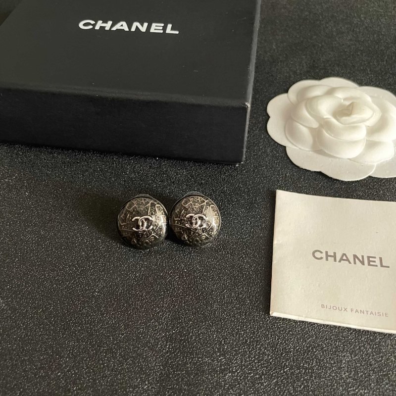 Chanel CC Logo Round Button Stud Earrings earrings ruthenium dark gunmetal with silver-tone interlocking CC logo dark translucent resin base with silver filigree detailing 1 5cm diameter