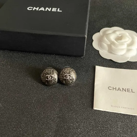 Chanel CC Logo Round Button Stud Earrings earrings ruthenium dark gunmetal with silver-tone interlocking CC logo dark translucent resin base with silver filigree detailing 1 5cm diameter
