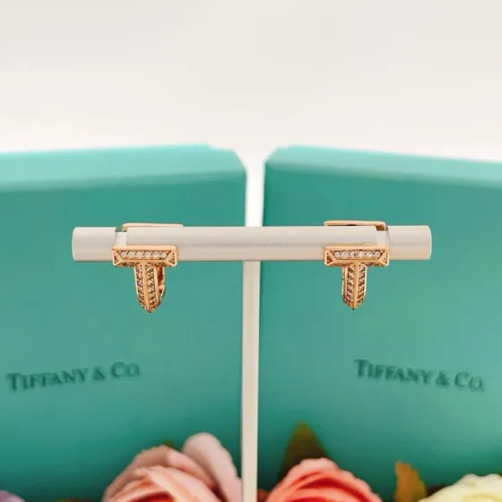 Tiffany Co Tiffany T earrings 18k rose gold with pave set clear diamonds 12mm hoop diameter