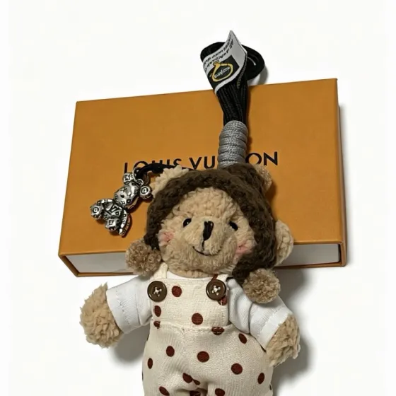 Louis Vuitton Anger Forest Bear Charm pendant silver tone metal beige plush brown knit white fabric with brown polka dots red and white knit black cord gray cord wrap 12cm total length