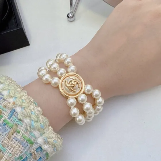 Chanel CC Turnlock Multi-Strand Pearl Bracelet bracelet Gold-tone metal cream white faux pearl 18cm