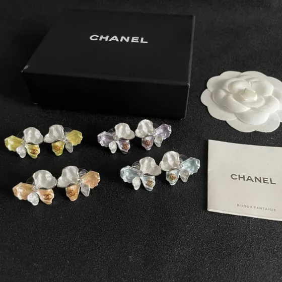 Chanel Iridescent Flower CC Stud Earrings earrings Silver-tone metal with pearlescent white pale yellow pale purple pale peach pale light blue enamel gold-tone interlocking CC logo clear crystal accent One Size 2cm width per earring