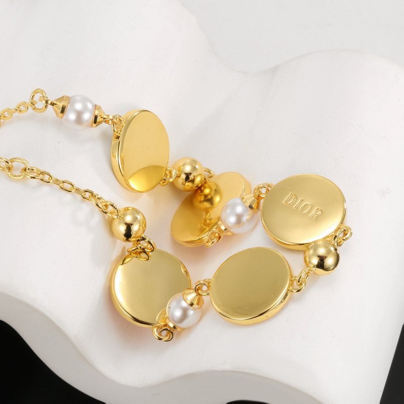Dior Lucky Charms Enamel Medallion Bracelet bracelet Gold-tone metal with white faux pearls pastel pink light blue lavender enamel and gold-toned charm details 18cm with 3cm extension chain