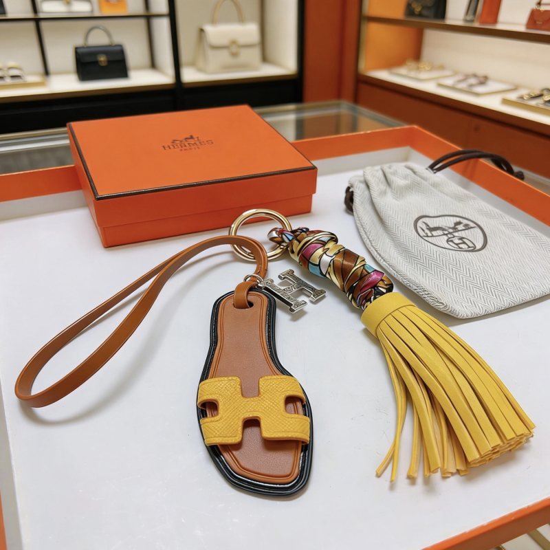 Hermes Oran Sandal Tassel Bag Charm pendant Gold-tone metal brown leather yellow leather multicolor silk silver-tone H charm 18cm strap length