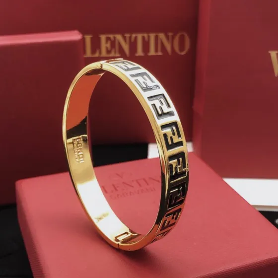 Fendi FF Logo Bangle bracelet gold-tone metal with black enamel FF detailing 17cm inner circumference