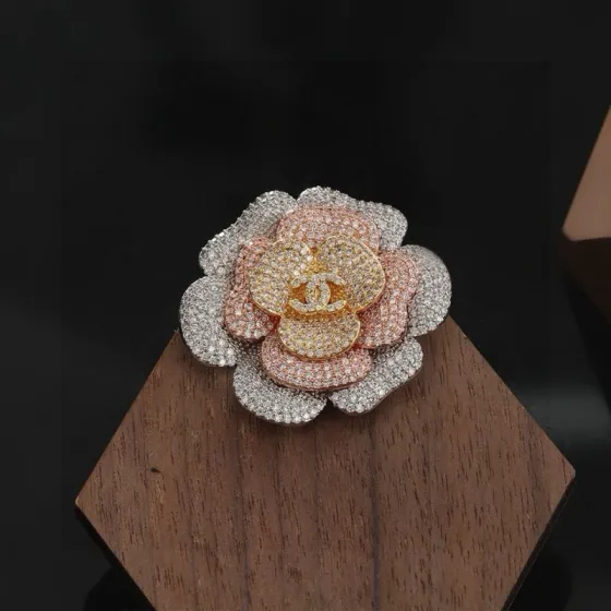 Chanel Camellia ring Tri-tone silver rose gold yellow gold metal with clear pave crystals US 7