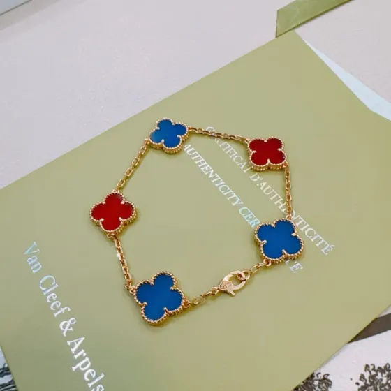 Van Cleef Arpels Alhambra bracelet Gold-toned metal with blue and red clover inlays 17cm