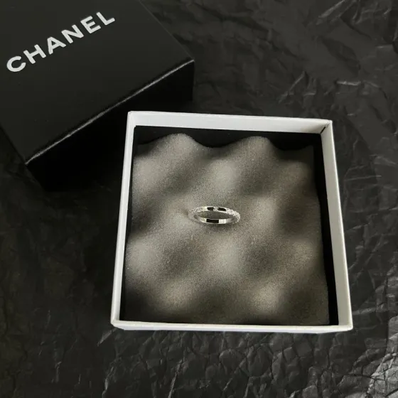Chanel CC Logo Stackable Band Ring ring Silver-toned metal with clear faceted stones and black enamel accents US 7