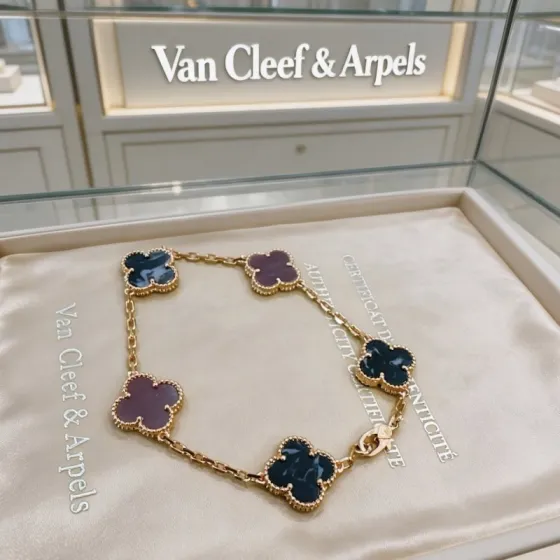 Van Cleef Arpels Vintage Alhambra bracelet Yellow gold metal with blue pietersite and purple chalcedony clover motifs 19cm