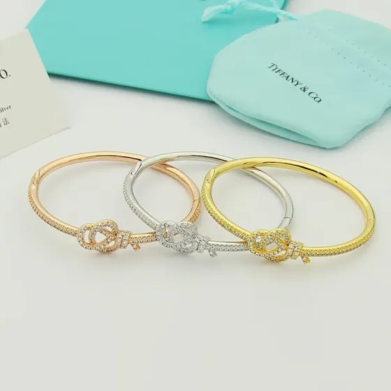 Tiffany Co Tiffany Keys Woven Key Hinged Bangle bracelet 18K yellow gold 18K rose gold 18K white gold with pave set clear diamonds 17cm inner circumference