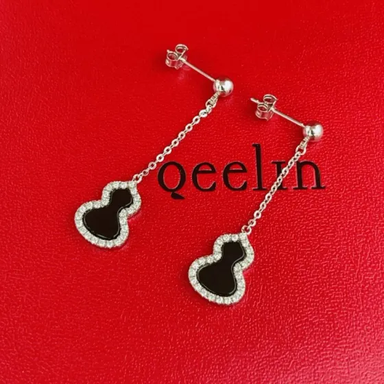 Qeelin Wulu earrings silver-toned white gold with black onyx and clear diamond accents 3cm drop length