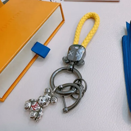 Louis Vuitton Anger Forest Bear Keychain pendant Gunmetal gray metal bright yellow braided leather silver-tone bear charm with red LV accent and black monogram detailing 12cm total length